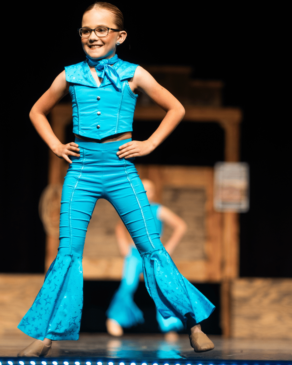 Dancer on Stage in Blue at Dance Recital Dancer on Stage in Blue at Dance Recital